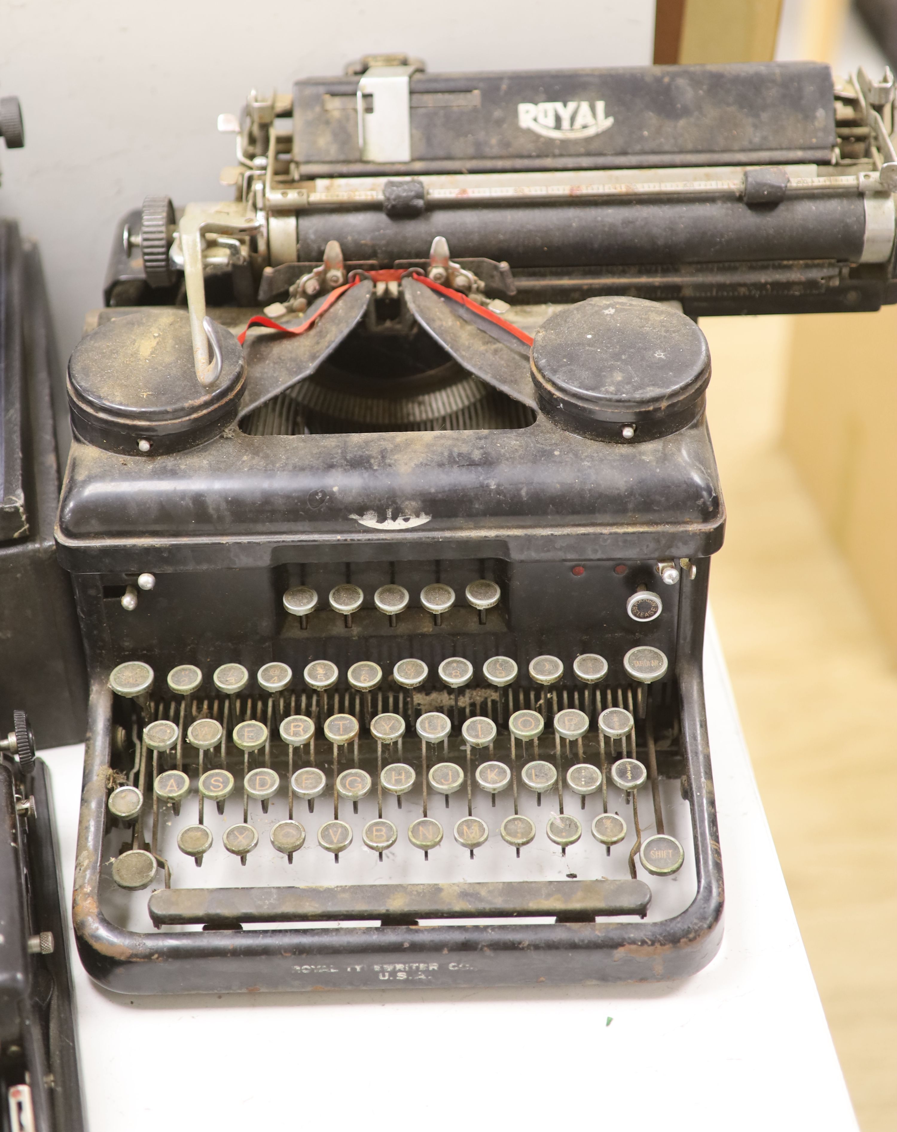 Three vintage typewriters: Underwood Standard portable, Remington Portable and Royal Typewriter Company